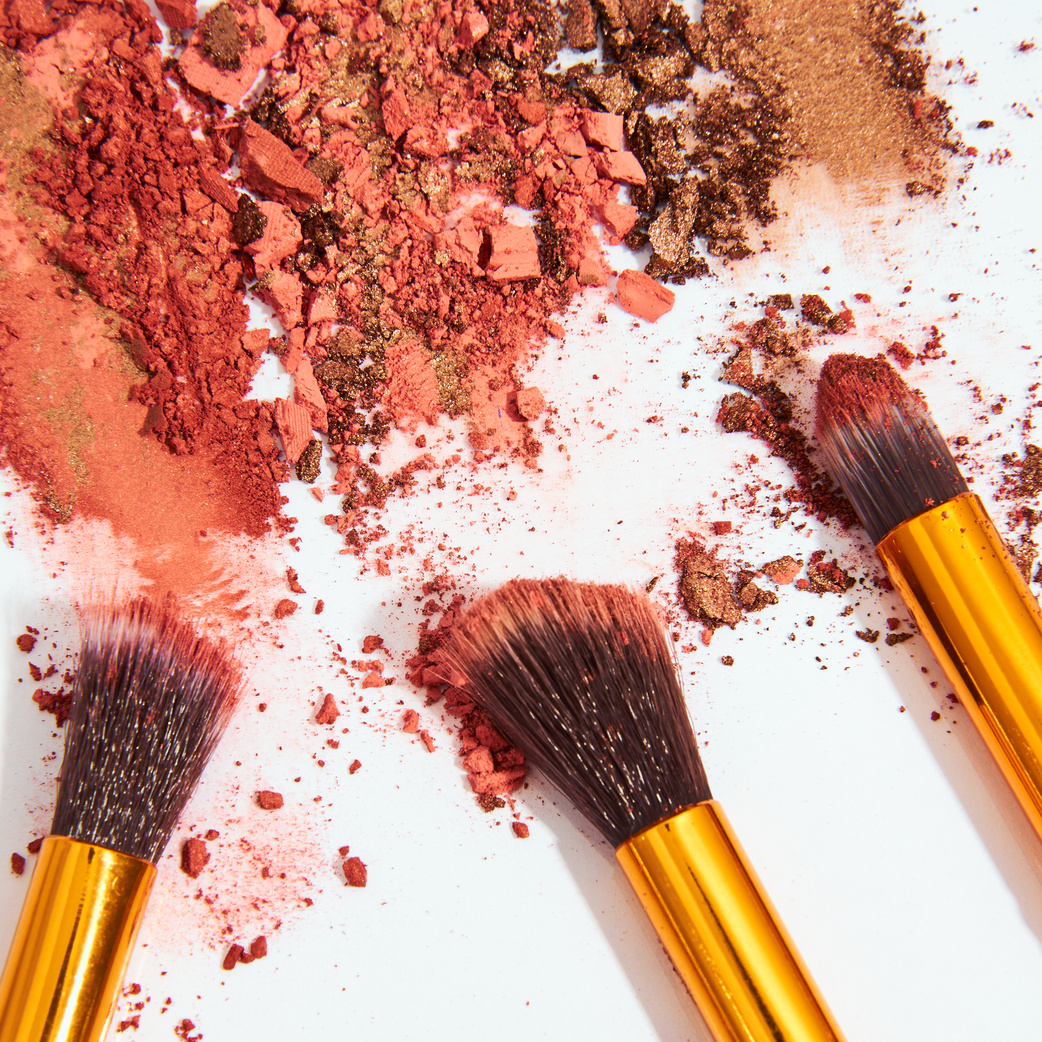 Blush Powder and Makeup Brushes on White Background